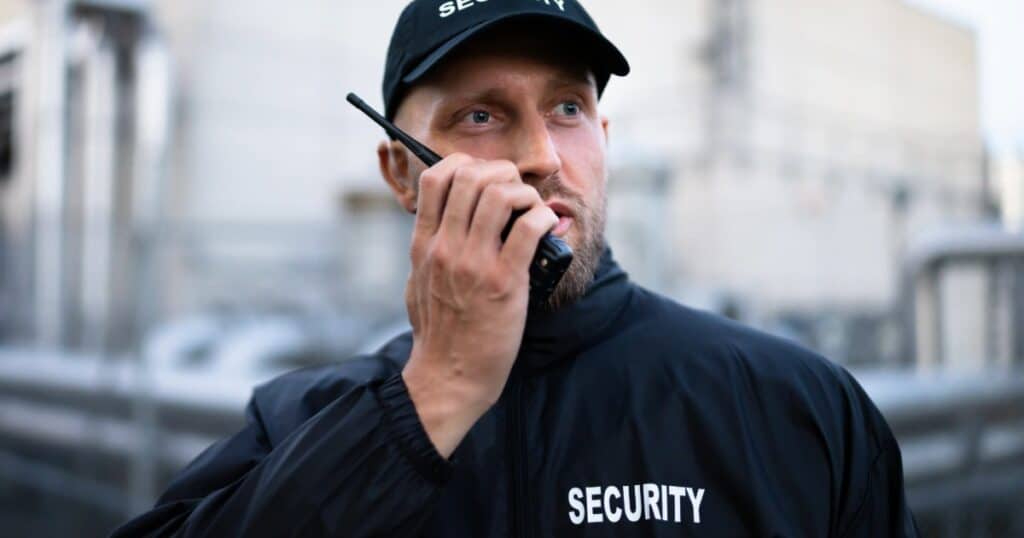 Security guard using radio at Nashville event security.